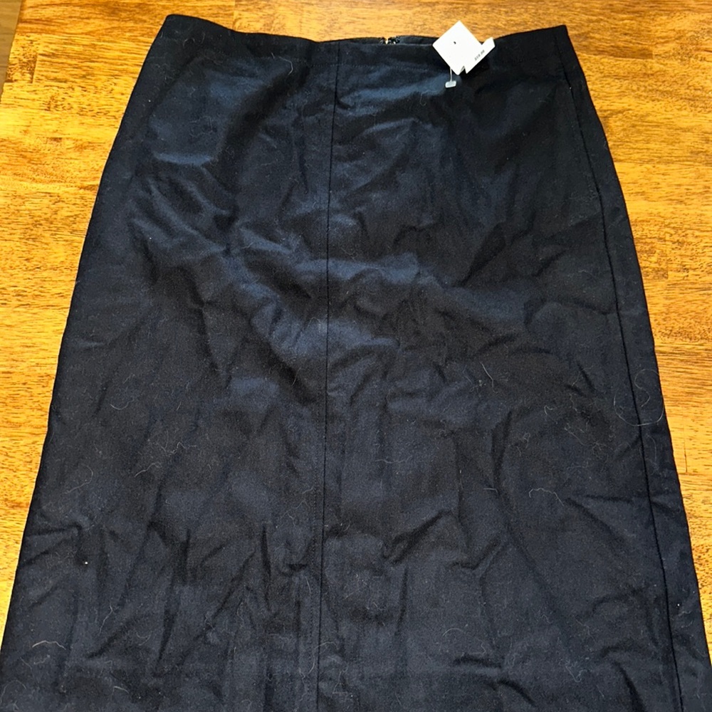 NWT J Crew Factory black skirt. Size 4. Back Zip. 23 inch length.Smoke free home
